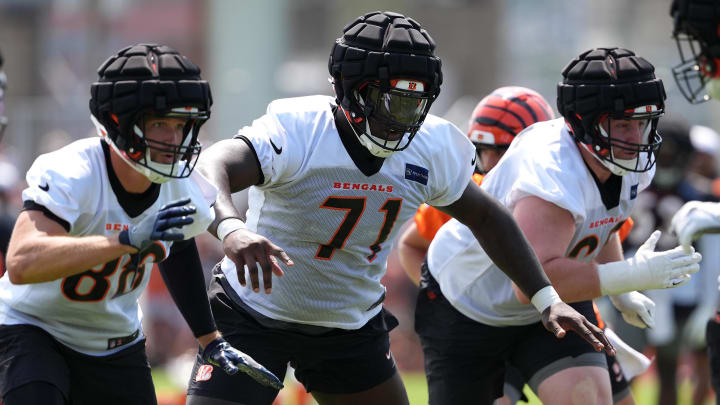 Jul 26, 2024; Cincinnati, OH, USA; Cincinnati Bengals offensive tackle Amarius Mims (71) run blocks during training camp practice at Kettering Health Practice Fields. Mandatory Credit: Kareem Elgazzar-USA TODAY Sports