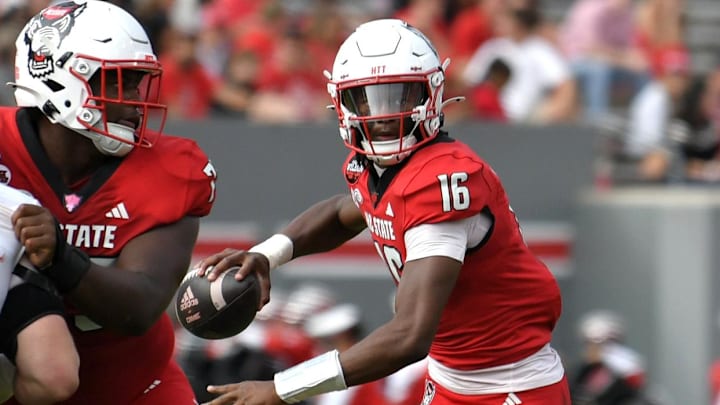 Nov 2, 2024; Raleigh, North Carolina, USA; North Carolina State Wolfpack quarter back CJ Bailey (16) drops the ball back for a pass during the second quarter against Stanford Cardinals at Carter-Finley Stadium. Mandatory Credit: Zachary Taft-Imagn Images Nov 2, 2024; Raleigh, North Carolina, USA; North Carolina State Wolfpack quarter back CJ Bailey (16) drops the ball back for a pass during the second quarter against Stanford Cardinals at Carter-Finley Stadium. Mandatory Credit: Zachary Taft-Imagn Images