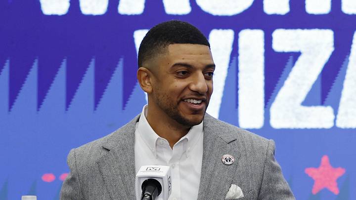 Jan 9, 2026; Washington, District of Columbia, USA; Washington Wizards general manager Will Dawkins (L) introduces newly acquired Wizards guard Trae Young (R) at a press conference prior to the Wizards' game against the New Orleans Pelicans at Capital One Arena. Mandatory Credit: Geoff Burke-Imagn Images