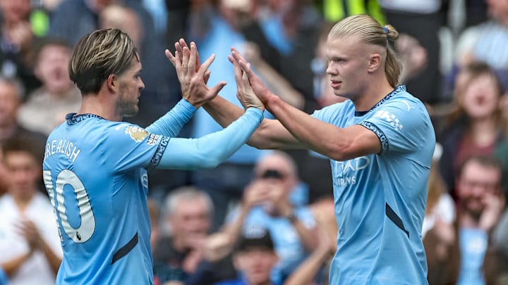 Jack Grealish (left) was left out of Manchester City's FIFA Club World Cup squad.