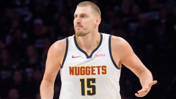 Apr 25, 2026; Minneapolis, Minnesota, USA; Denver Nuggets center Nikola Jokic (15) reacts to a play against the Minnesota Timberwolves in the first quarter at Target Center. Mandatory Credit: Matt Blewett-Imagn Images