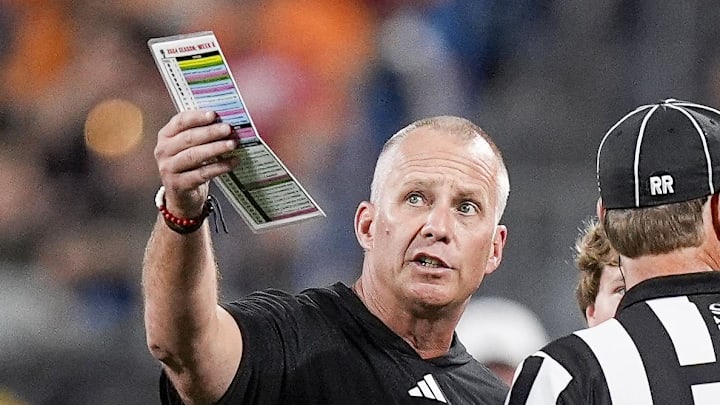 Sep 7, 2024; Charlotte, North Carolina, USA; North Carolina State Wolfpack head coach Dave Doeren talks with officials during the first quarter against the Tennessee Volunteers at the Dukes Mayo Classic at Bank of America Stadium. Mandatory Credit: Jim Dedmon-Imagn Images Sep 7, 2024; Charlotte, North Carolina, USA; North Carolina State Wolfpack head coach Dave Doeren talks with officials during the first quarter against the Tennessee Volunteers at the Dukes Mayo Classic at Bank of America Stadium. Mandatory Credit: Jim Dedmon-Imagn Images
