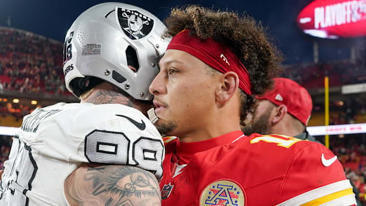 Nov 29, 2024; Kansas City, Missouri, USA; Kansas City Chiefs quarterback Patrick Mahomes (15) greets Las Vegas Raiders defensive end Maxx Crosby (98) after the game at GEHA Field at Arrowhead Stadium. Mandatory Credit: Denny Medley-Imagn Images