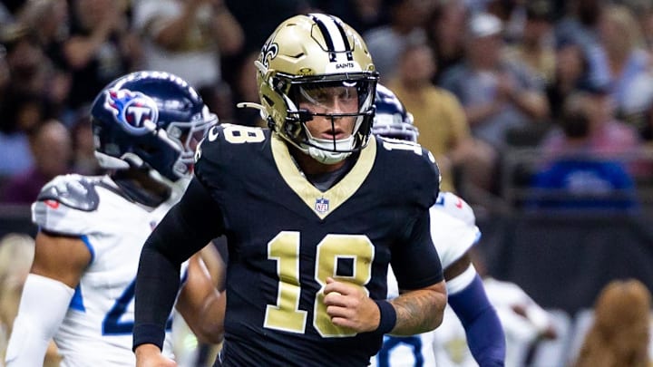 Aug 25, 2024; New Orleans, Louisiana, USA;  New Orleans Saints quarterback Spencer Rattler (18) reacts to passing a touchdown against the Tennessee Titans during the first half at Caesars Superdome. Mandatory Credit: Stephen Lew-Imagn Images