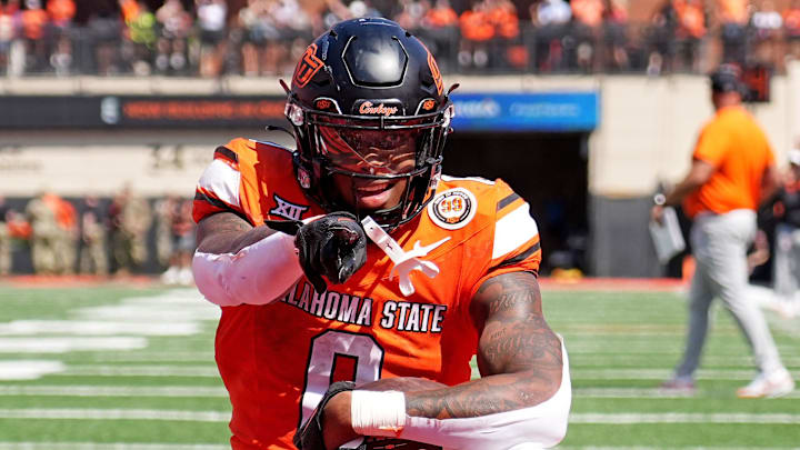 Oklahoma State's Ollie Gordon II (0) celebrates a 2-point conversion front of /tJaylon Braxton (11) in double overtime of the college football game between the Oklahoma State Cowboys and the Arkansas Razorbacks at Boone Pickens Stadium in Stillwater, Okla.,, Saturday, Sept., 7, 2024.