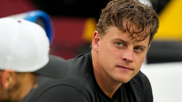 Cincinnati Bengals quarterback Joe Burrow (9) talks on the bench with quarterback Desmond Ridder (4) before the first quarter of the NFL Preseason Week 2 game between the Washington Commanders and the Cincinnati Bengals at Northwest Stadium in Landover, Md., on Monday, Aug. 18, 2025.