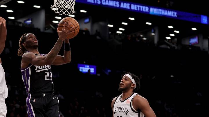Jan 27, 2025; Brooklyn, New York, USA; Sacramento Kings guard Keon Ellis (23) drives to the basket against Brooklyn Nets guard Reece Beekman (4) and center Day'Ron Sharpe (20) during the fourth quarter at Barclays Center. Mandatory Credit: Brad Penner-Imagn Images Jan 27, 2025; Brooklyn, New York, USA; Sacramento Kings guard Keon Ellis (23) drives to the basket against Brooklyn Nets guard Reece Beekman (4) and center Day'Ron Sharpe (20) during the fourth quarter at Barclays Center. Mandatory Credit: Brad Penner-Imagn Images