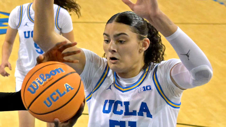 Dec 20, 2025; Los Angeles, California, USA; UCLA Bruins forward Sienna Betts (16) and center Lauren Betts (51) defend a shot by Long Beach State Beach forward Rosie Akot (2) during the second half at Pauley Pavilion presented by Wescom Financial. Mandatory Credit: Jayne Kamin-Oncea-Imagn Images