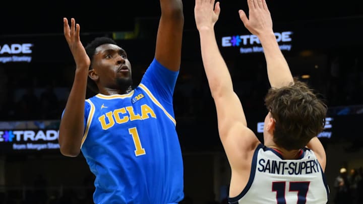 Dec 13, 2025; Seattle, Washington, USA; UCLA Bruins center Xavier Booker (1) shoots the ball over Gonzaga Bulldogs guard Mario Saint-Supery (17) during the second half at Climate Pledge Arena. Mandatory Credit: Steven Bisig-Imagn Images