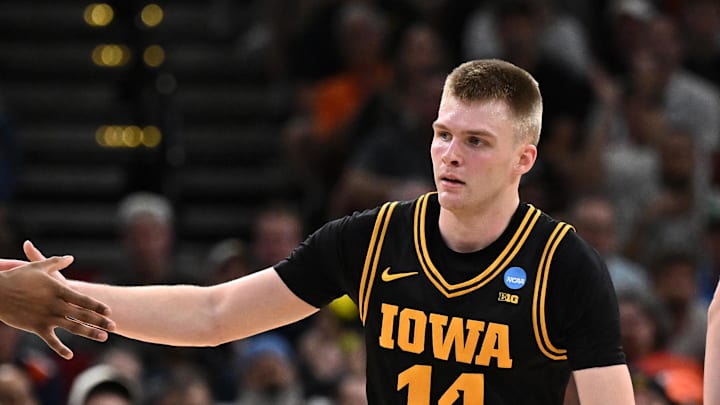 Mar 28, 2026; Houston, TX, USA; Iowa Hawkeyes guard Bennett Stirtz (14) and forward Cam Manyawu (3) react in the first half against the Illinois Fighting Illini during an Elite Eight game of the South Regional of the men's 2026 NCAA Tournament at Toyota Center. Mandatory Credit: Maria Lysaker-Imagn Images Mar 28, 2026; Houston, TX, USA; Iowa Hawkeyes guard Bennett Stirtz (14) and forward Cam Manyawu (3) react in the first half against the Illinois Fighting Illini during an Elite Eight game of the South Regional of the men's 2026 NCAA Tournament at Toyota Center. Mandatory Credit: Maria Lysaker-Imagn Images