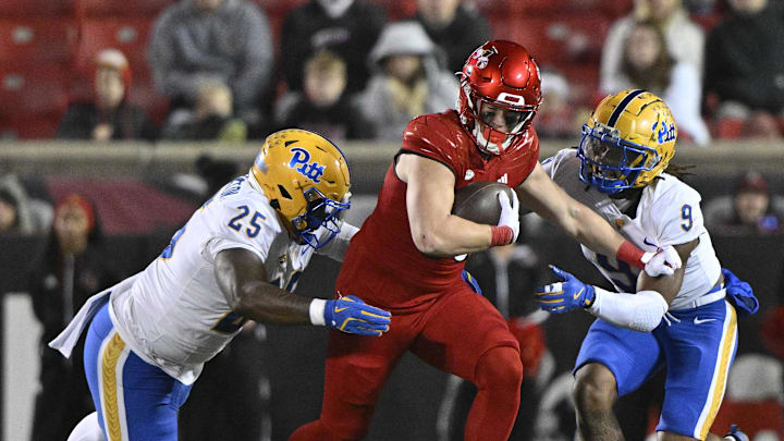 Nov 23, 2024; Louisville, Kentucky, USA; Louisville Cardinals tight end Nate Kurisky (85) runs against Pittsburgh Panthers defensive lineman Jahsear Whittington (25) and linebacker Kyle Louis (9) during the second half at L&N Federal Credit Union Stadium. Louisville defeated Pittsburgh 37-9. Mandatory Credit: Jamie Rhodes-Imagn Images Nov 23, 2024; Louisville, Kentucky, USA; Louisville Cardinals tight end Nate Kurisky (85) runs against Pittsburgh Panthers defensive lineman Jahsear Whittington (25) and linebacker Kyle Louis (9) during the second half at L&N Federal Credit Union Stadium. Louisville defeated Pittsburgh 37-9. Mandatory Credit: Jamie Rhodes-Imagn Images