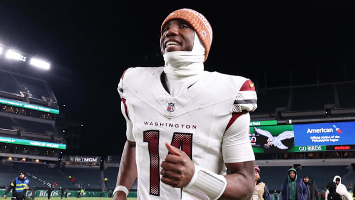 Jan 4, 2026; Philadelphia, Pennsylvania, USA; Washington Commanders quarterback Josh Johnson (14) runs off the field after a victory against the Philadelphia Eagles at Lincoln Financial Field. Mandatory Credit: Bill Streicher-Imagn Images