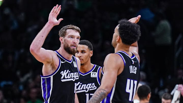 Jan 10, 2025; Boston, Massachusetts, USA; Sacramento Kings forward Domantas Sabonis (11) and forward Trey Lyles (41) react after defeating the Boston Celtics in the second half at TD Garden. Mandatory Credit: David Butler II-Imagn Images