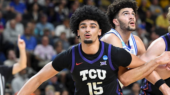 TCU Horned Frogs forward David Punch (15) and TCU Horned Frogs guard Liutauras Lelevicius (3) box out Duke Blue Devils forward Cameron Boozer (12) Saturday, March 21, 2026, during the NCAA Men’s Basketball Tournament second round game at Bon Secours Wellness Arena in Greenville, South Carolina.