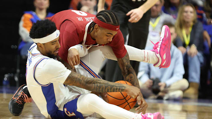 Alabama guard Labaron Philon (0) and Florida guard Boogie Fland (0) fight for the ball during the first half of an NCAA Mens basketball game at Steven C. O'Connell Center Exactek arena in Gainesville, FL on Sunday, February 1, 2026. [Alan Youngblood/Gainesville Sun]