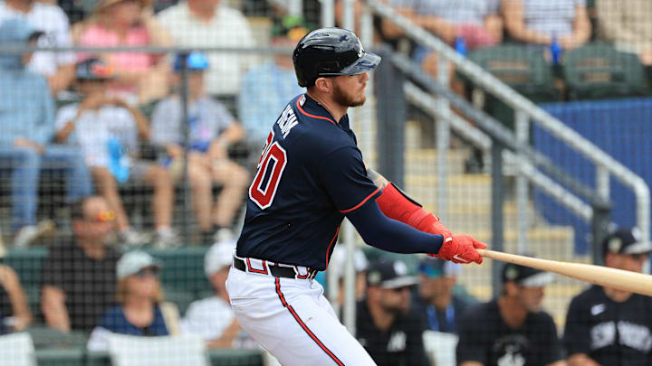 Mar 13, 2026; North Port, Florida, USA;  AAtlanta Braves catcher Jonah Heim (20) hits an RBI single during the first inning against the New York Yankees at CoolToday Park. Mandatory Credit: Kim Klement Neitzel-Imagn Images
