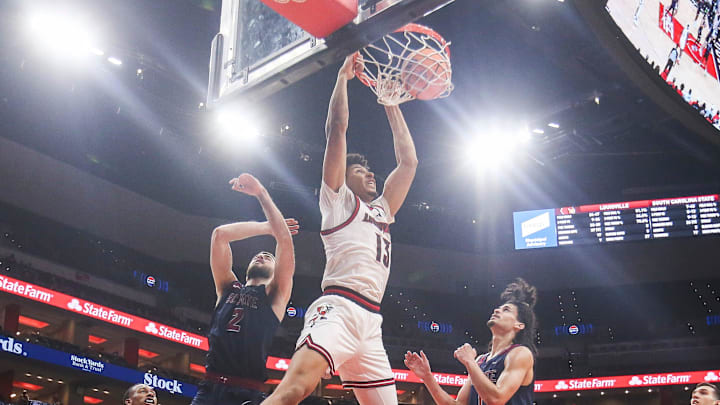 Louisville Cardinals forward Sananda Fru (13) slams down two points in the second half as the Cards roll past South Carolina State 104-45 at the KFC Yum! Center Monday night, Nov. 3, 2025. Louisville Cardinals forward Sananda Fru (13) slams down two points in the second half as the Cards roll past South Carolina State 104-45 at the KFC Yum! Center Monday night, Nov. 3, 2025.