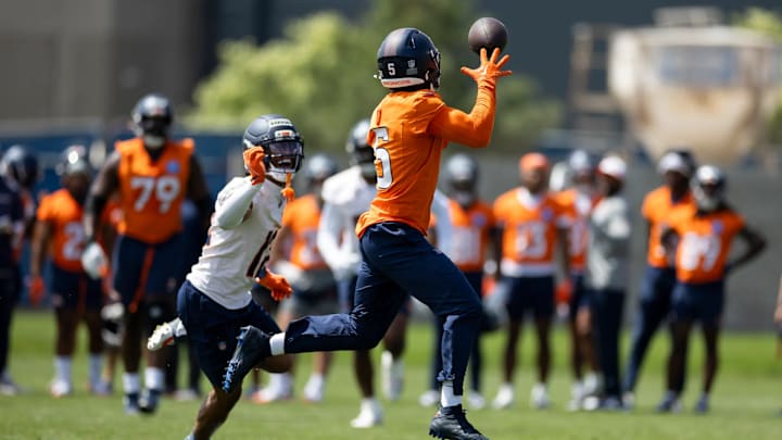 Denver Broncos wide receiver Trent Sherfield (5) catches a pass with cornerback Jahdae Barron (12) in coverage during mandatory minicamp at Broncos Park Powered by CommonSpirit. Denver Broncos wide receiver Trent Sherfield (5) catches a pass with cornerback Jahdae Barron (12) in coverage during mandatory minicamp at Broncos Park Powered by CommonSpirit.