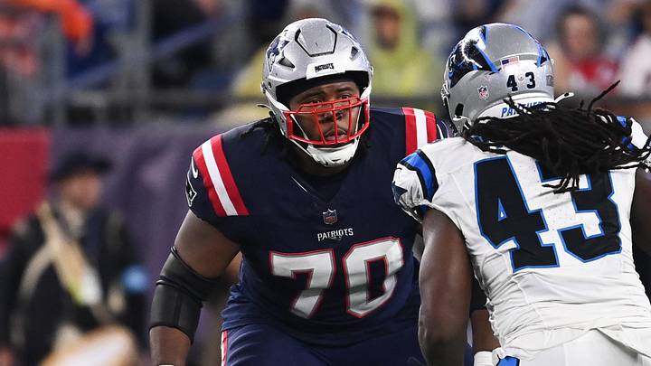 August 8, 2024; Foxborough, MA, USA; New England Patriots offensive tackle Caedan Wallace (70) lines up with Carolina Panthers linebacker Luiji Vilain (43) during the first half at Gillette Stadium. Mandatory Credit: Eric Canha-Imagn Images August 8, 2024; Foxborough, MA, USA; New England Patriots offensive tackle Caedan Wallace (70) lines up with Carolina Panthers linebacker Luiji Vilain (43) during the first half at Gillette Stadium. Mandatory Credit: Eric Canha-Imagn Images