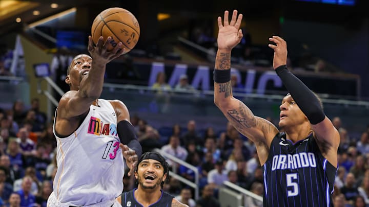Miami Heat center Bam Adebayo (left) goes to the basket against Orlando Magic forward Paolo Banchero during a game last season.
