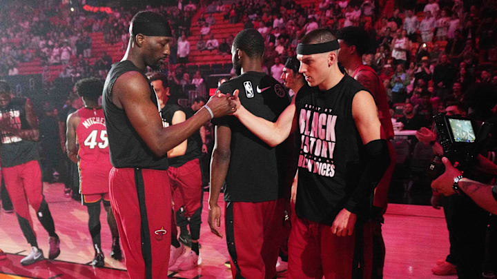 Feb 26, 2025; Miami, Florida, USA;  Miami Heat center Bam Adebayo, left, and guard Tyler Herro (14) greet each other during team introductions before the game against the Atlanta Hawks at Kaseya Center. Mandatory Credit: Jim Rassol-Imagn Images