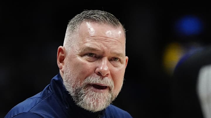 Apr 6, 2025; Denver, Colorado, USA; Denver Nuggets head coach Michael Malone reacts towards referee Danielle Scott (87) in the second half against the Indiana Pacers at Ball Arena. Mandatory Credit: Ron Chenoy-Imagn Images