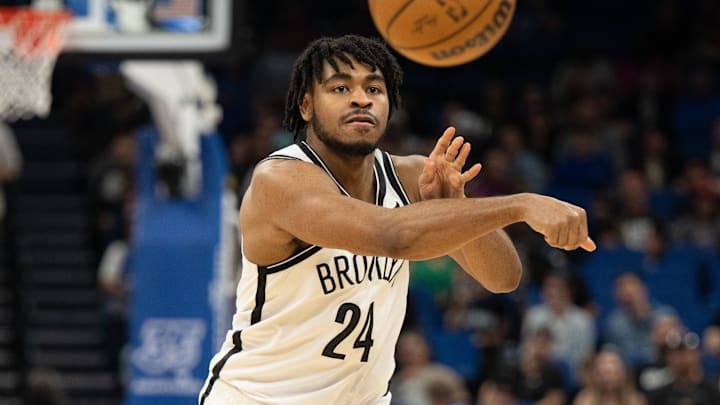 Mar 13, 2024; Orlando, Florida, USA; Brooklyn Nets guard Cam Thomas (24) passes the ball against the Orlando Magic in the first quarter at Kia Center. Mandatory Credit: Jeremy Reper-Imagn Images