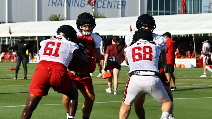 Tampa Bay Buccaneers offensive tackle Luke Haggard (72), offensive tackle Michael Niese (68) and offensive tackle Silas Dzansi (61).