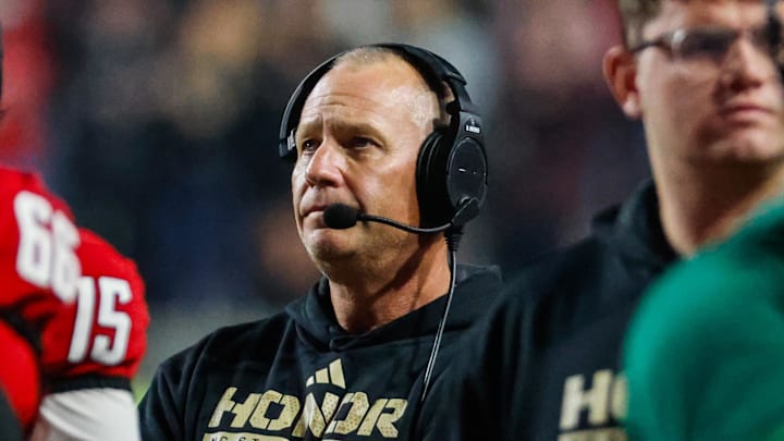 Nov 21, 2025; Raleigh, North Carolina, USA;  NC State Wolfpack head coach Dave Doeren looks on during the second half of the game against Florida State Seminoles at Carter-Finley Stadium. Mandatory Credit: Jaylynn Nash-Imagn Images