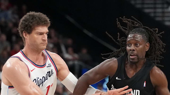 Portland Trail Blazers guard Jrue Holiday dribbles against LA Clippers center Brook Lopez. Portland Trail Blazers guard Jrue Holiday dribbles against LA Clippers center Brook Lopez.