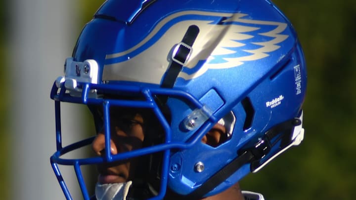 Santa Margarita remained focused late and came away with a blocked PAT to preserve a tie with 49 seconds to go before winning in overtime to give coach Carson Palmer his first victory with the Eagles as coach of his alma mater.