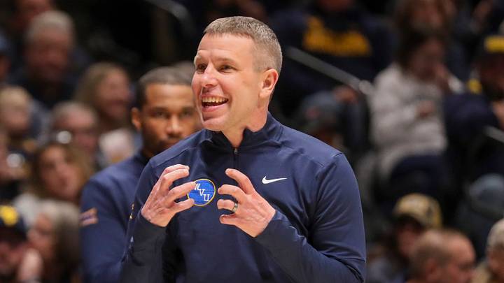Jan 31, 2026; Morgantown, West Virginia, USA; West Virginia Mountaineers head coach Ross Hodge talks with West Virginia Mountaineers guard Honor Huff (3) during the first half against the Baylor Bears at Hope Coliseum. Mandatory Credit: Ben Queen-Imagn Images