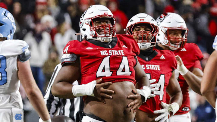 Nov 29, 2025; Raleigh, North Carolina, USA;  NC State Wolfpack defensive tackle Brandon Cleveland (44) reacts to his tackle during the first half of the game against the North Carolina Tar Heels at Carter-Finley Stadium.  Mandatory Credit: Jaylynn Nash-Imagn Images