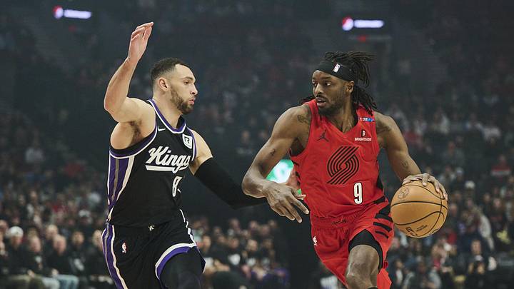 Feb 6, 2025; Portland, Oregon, USA; Portland Trail Blazers forward Jerami Grant (9) drives to the basket the ball during the first half against Sacramento Kings guard Zach LaVine (8) at Moda Center. Mandatory Credit: Troy Wayrynen-Imagn Images