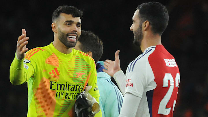 David Raya (left) and Mikel Merino (right) celebrate Arsenal's win over PSG in the Champions League.