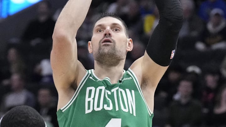 Mar 2, 2026; Milwaukee, Wisconsin, USA; Boston Celtics center Nikola Vucevic (4) shoots the ball against Milwaukee Bucks forward Bobby Portis (9) in the second half at Fiserv Forum. Mandatory Credit: Michael McLoone-Imagn Images