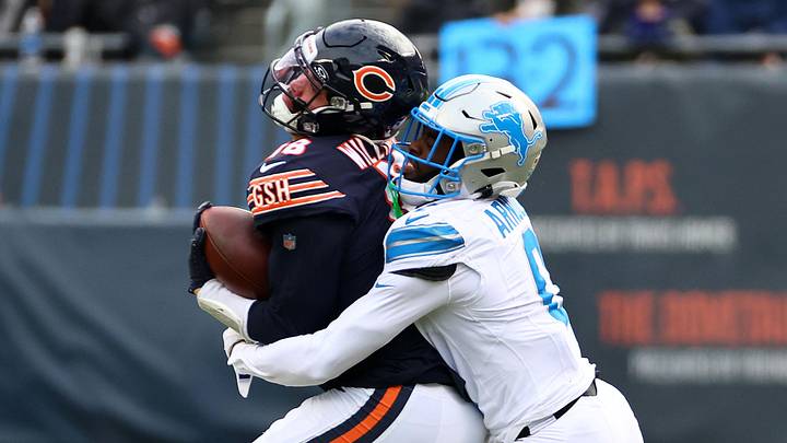 Chicago Bears quarterback Caleb Williams (18) is hit by Detroit Lions cornerback Terrion Arnold (0) 