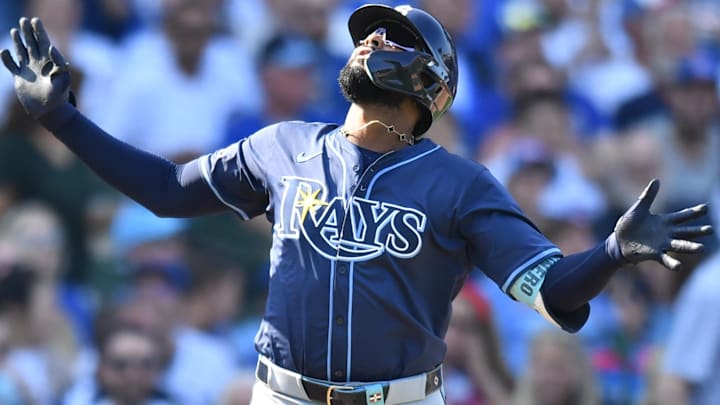 Sep 13, 2025; Chicago, Illinois, USA; Tampa Bay Rays third baseman Junior Caminero (13) celebrates after hitting a solo home run against the Chicago Cubs during the eighth inning at Wrigley Field.