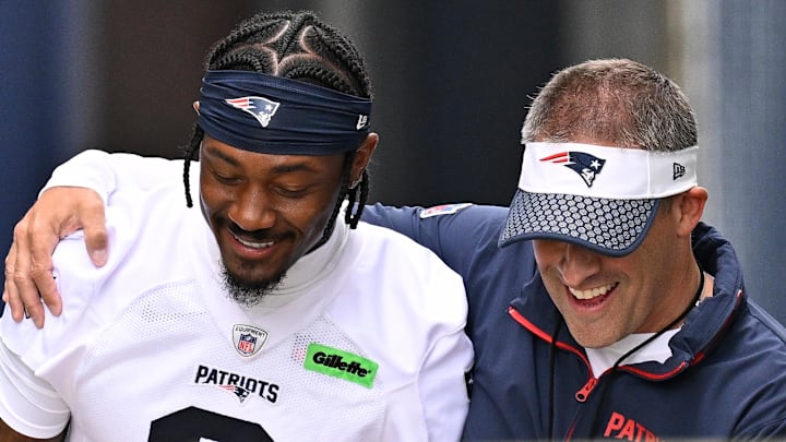 Jun 9, 2025; Foxborough, MA, USA; New England Patriots offensive coordinator Josh McDaniels (r) walks to the practice field with his arm around wide receiver Stefon Diggs (8) before  minicamp at Gillette Stadium. Mandatory Credit: Eric Canha-Imagn Images