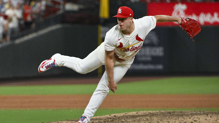 Jul 24, 2025; St. Louis, Missouri, USA;  St. Louis Cardinals relief pitcher Ryan Helsley (56) pitches against the San Diego Padres during the ninth inning at Busch Stadium. 