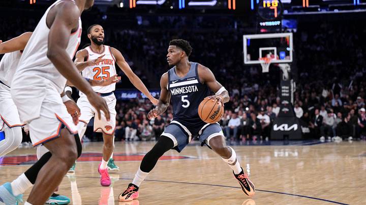 Oct 9, 2025; New York, New York, USA; Minnesota Timberwolves guard Anthony Edwards (5) sets the play while defended by New York Knicks guard/forward Mikal Bridges (25) during the first half at Madison Square Garden. Mandatory Credit: John Jones-Imagn Images