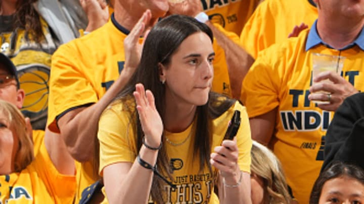 Indiana Fever's Caitlin Clark cheers on the Indiana Pacers during the NBA Finals.