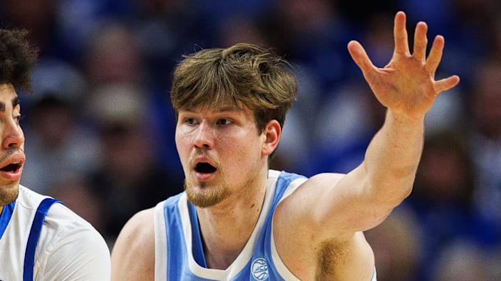 Dec 2, 2025; Lexington, Kentucky, USA; Kentucky Wildcats center Malachi Moreno (24) handles the ball against North Carolina Tar Heels center Henri Veesaar (13) during the first half at Rupp Arena at Central Bank Center. Mandatory Credit: Jordan Prather-Imagn Images