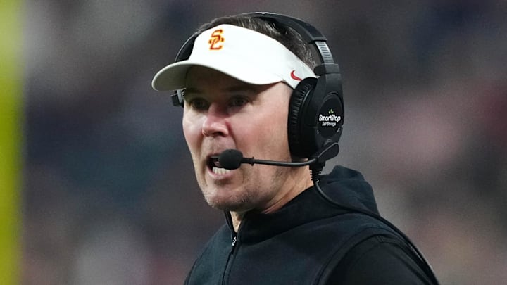 Dec 27, 2024; Las Vegas, NV, USA; Southern California Trojans head coach Lincoln Riley reacts against the Texas A&M Aggies in the first half at Allegiant Stadium. Mandatory Credit: Kirby Lee-Imagn Images Dec 27, 2024; Las Vegas, NV, USA; Southern California Trojans head coach Lincoln Riley reacts against the Texas A&M Aggies in the first half at Allegiant Stadium. Mandatory Credit: Kirby Lee-Imagn Images