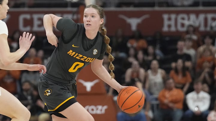 Jan 30, 2025; Austin, Texas, USA; Missouri Tigers guard Grace Slaughter (0) looks to pass the ball while defended by Texas Longhorns guard Shay Holle (10) during the second half at Moody Center. Mandatory Credit: Scott Wachter-Imagn Images Jan 30, 2025; Austin, Texas, USA; Missouri Tigers guard Grace Slaughter (0) looks to pass the ball while defended by Texas Longhorns guard Shay Holle (10) during the second half at Moody Center. Mandatory Credit: Scott Wachter-Imagn Images