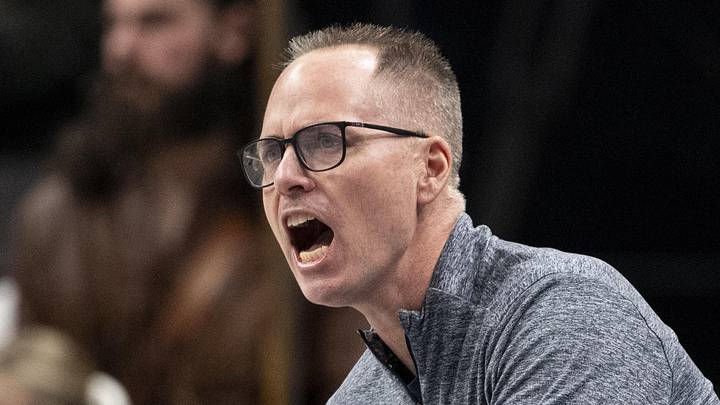 Mar 7, 2025; Kansas City, MO, USA; West Virginia Mountaineers head coach Mark Kellogg looks on from the sideline in the first quarter against the Kansas State Wildcats at T-Mobile Center. Mandatory Credit: Amy Kontras-Imagn Images