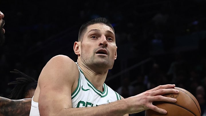 Feb 11, 2026; Boston, Massachusetts, USA; Boston Celtics center Nikola Vucevic (4) drives on Chicago Bulls center Nick Richards (13) during the first quarter at TD Garden. Mandatory Credit: Winslow Townson-Imagn Images