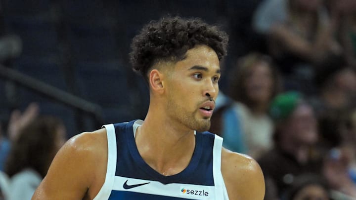 Oct 7, 2025; Minneapolis, Minnesota, USA; Minnesota Timberwolves forward Johnny Juzang (9) follows the play against the Indiana Pacers during the fourth quarter at Target Center. Mandatory Credit: Nick Wosika-Imagn Images