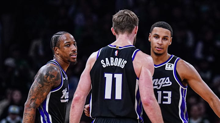 Jan 10, 2025; Boston, Massachusetts, USA; Sacramento Kings forward DeMar DeRozan (10), forward Keegan Murray (13) and forward Domantas Sabonis (11) react after defeating the Boston Celtics at TD Garden. Jan 10, 2025; Boston, Massachusetts, USA; Sacramento Kings forward DeMar DeRozan (10), forward Keegan Murray (13) and forward Domantas Sabonis (11) react after defeating the Boston Celtics at TD Garden.
