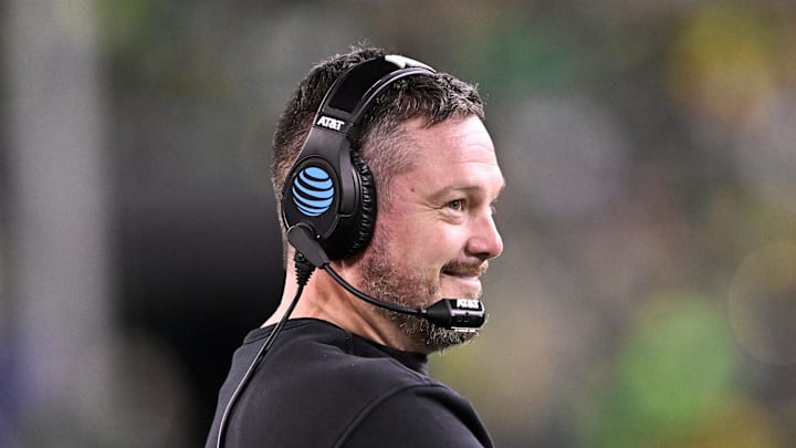 Dec 20, 2025; Eugene, OR, USA;  Oregon Ducks head coach Dan Lanning smiles during the third quarter against the James Madison Dukes at Autzen Stadium. Mandatory Credit: Craig Strobeck-Imagn Images